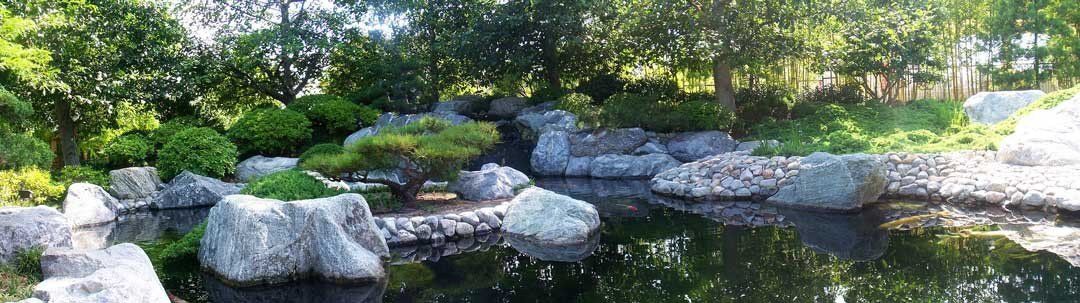 Japanese garden mural with tranquil pond, ideal for indoor and outdoor spaces.