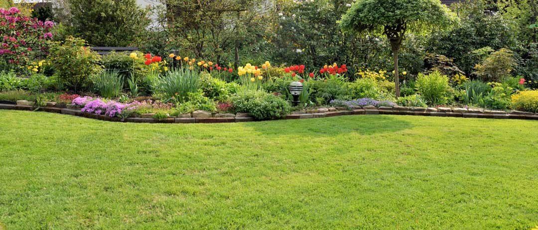 Luxurious spring garden mural with stone walls and greenery, perfect for indoor and outdoor spaces.