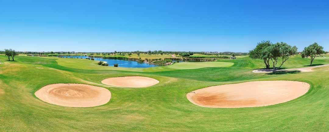 Sunny golf course mural with green fairways, pond, and sand traps, ideal for indoor and outdoor spaces.