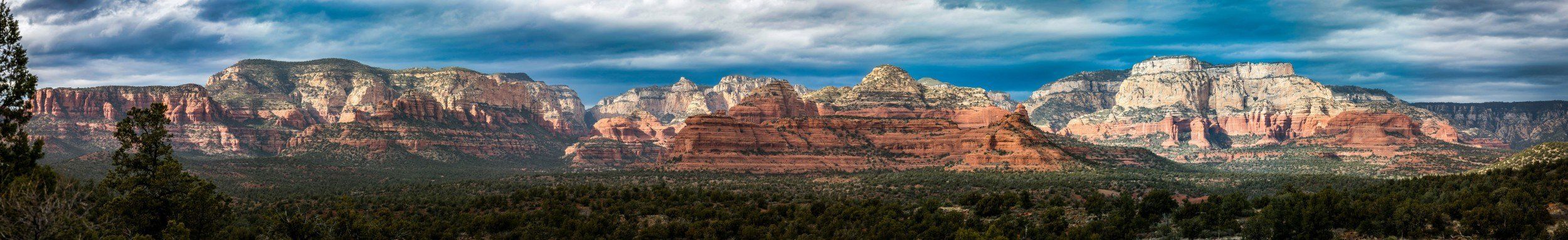 Panoramic mural of Sedona's red rocks and Mescal Mountain, perfect for indoor and outdoor spaces.