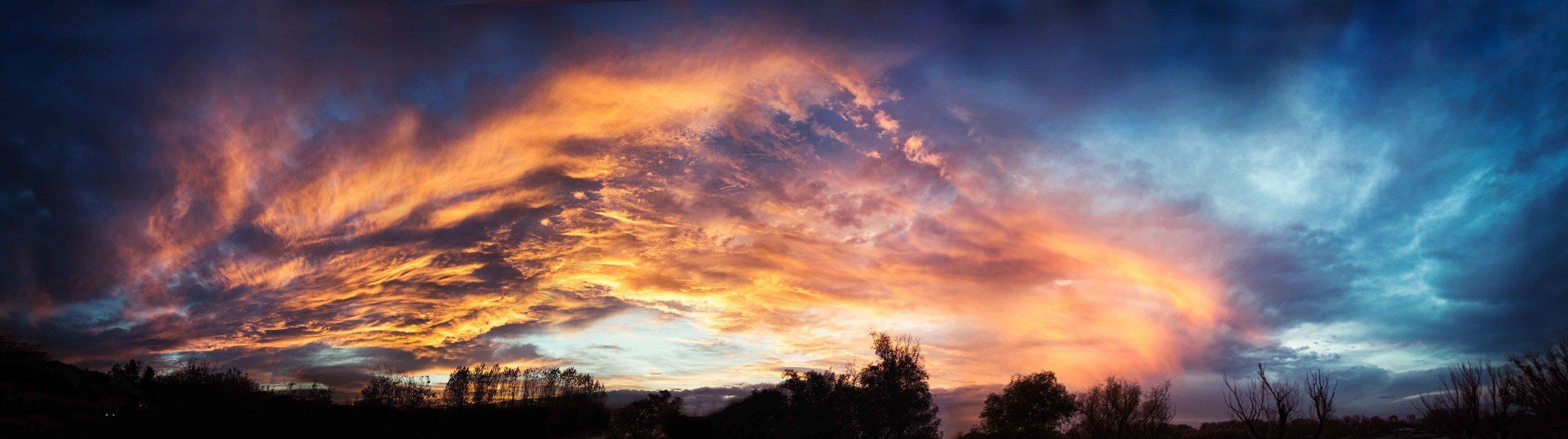 Panoramic sunset sky mural, ideal for adding vibrant beauty to indoor and outdoor spaces.