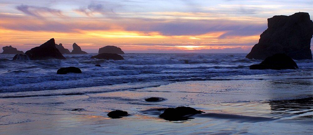 Seastacks at low tide sunset mural, ideal for indoor and outdoor spaces.
