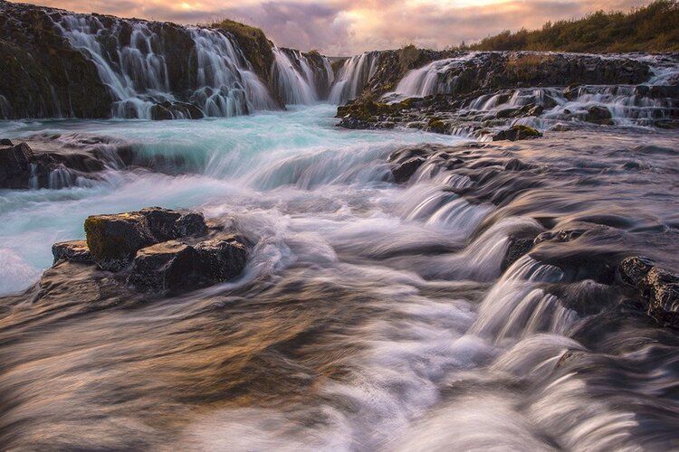 Wall mural of Bruarfoss Waterfall, with striking blue waters, perfect for indoor or outdoor spaces.