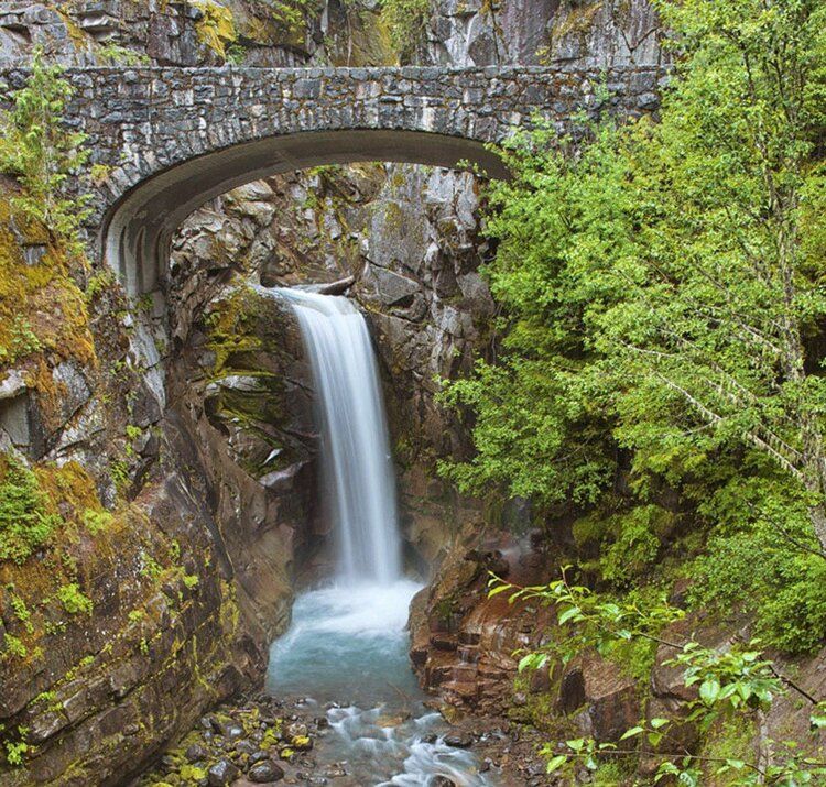 Wall mural of Christine Falls with stone bridge, ideal for indoor or outdoor spaces.