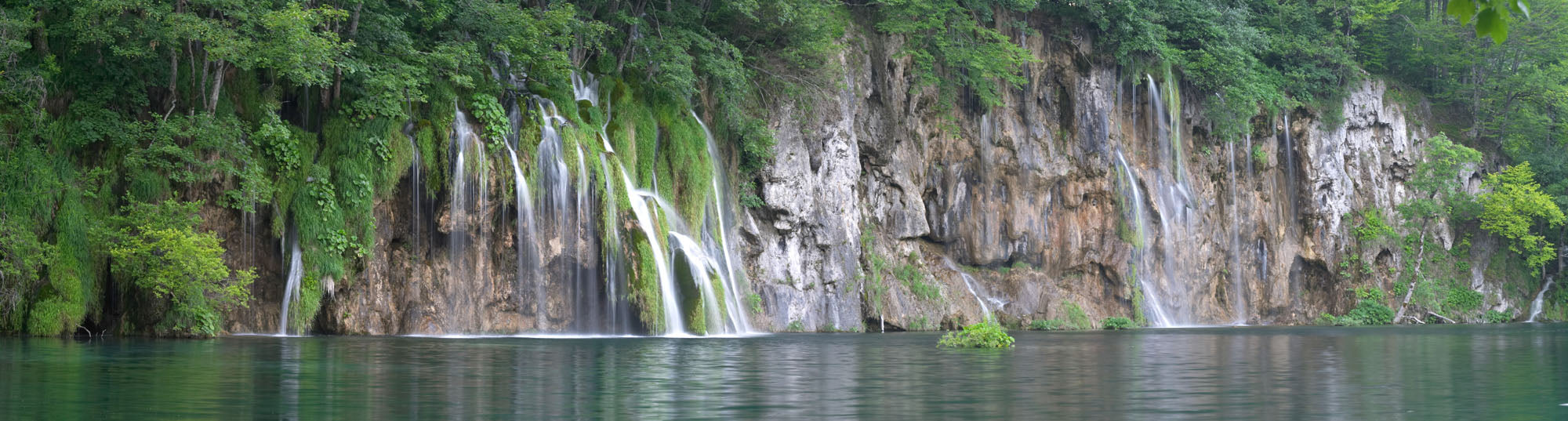 Panoramic mural of Plitvice Lakes waterfall, perfect for a serene indoor or outdoor atmosphere.