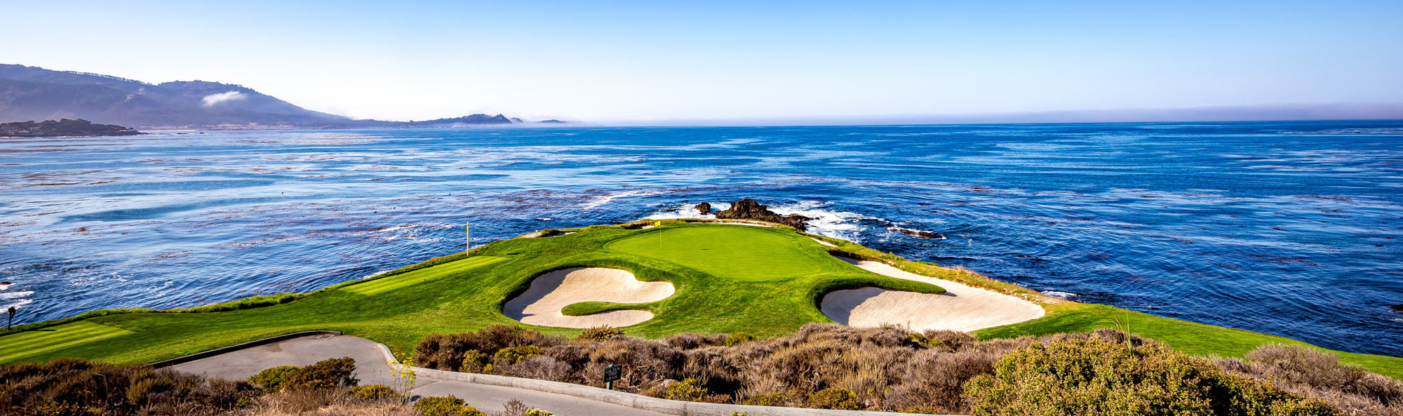 Panoramic mural of Pebble Beach Golf Course, ideal for adding coastal elegance indoors or outdoors.