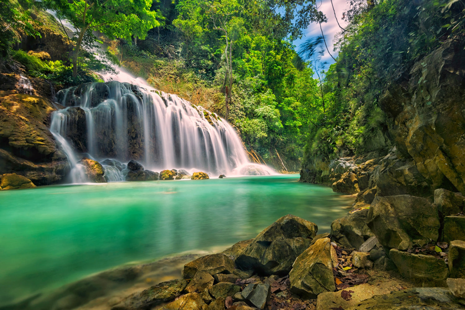 Panoramic mural of Lapopu Waterfall, perfect for enhancing indoor and outdoor spaces with natural beauty.