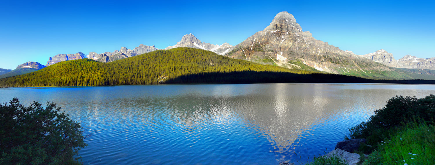 Panoramic mural of mountain lake and peaks in Banff, perfect for indoor and outdoor spaces.
